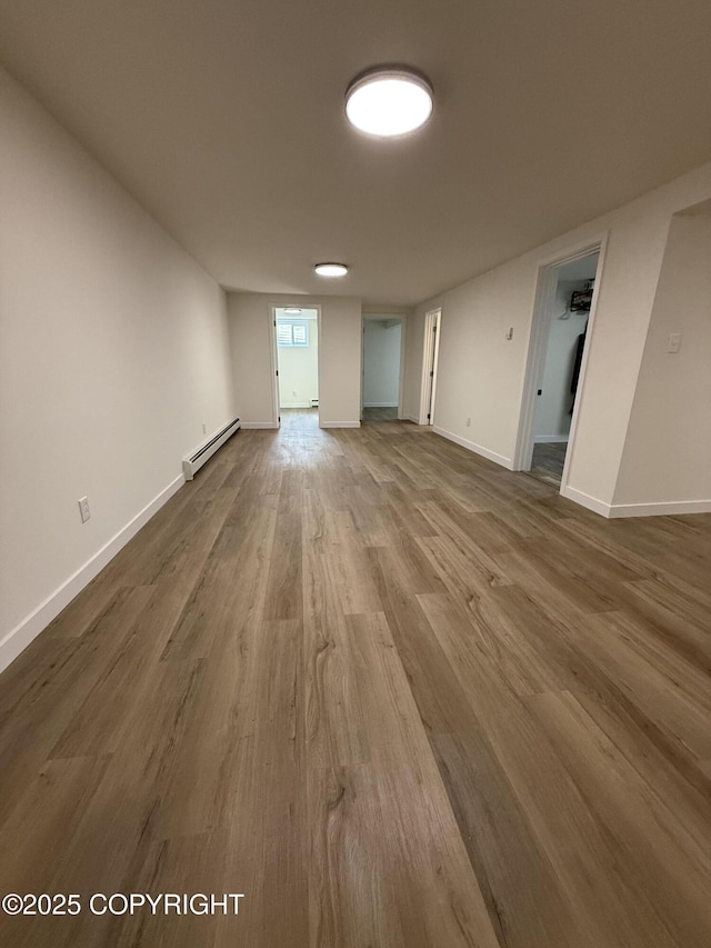 1510 Fathom Dr, Kenai, AK 99611 - unfurnished room with baseboard heating and wood finished floors