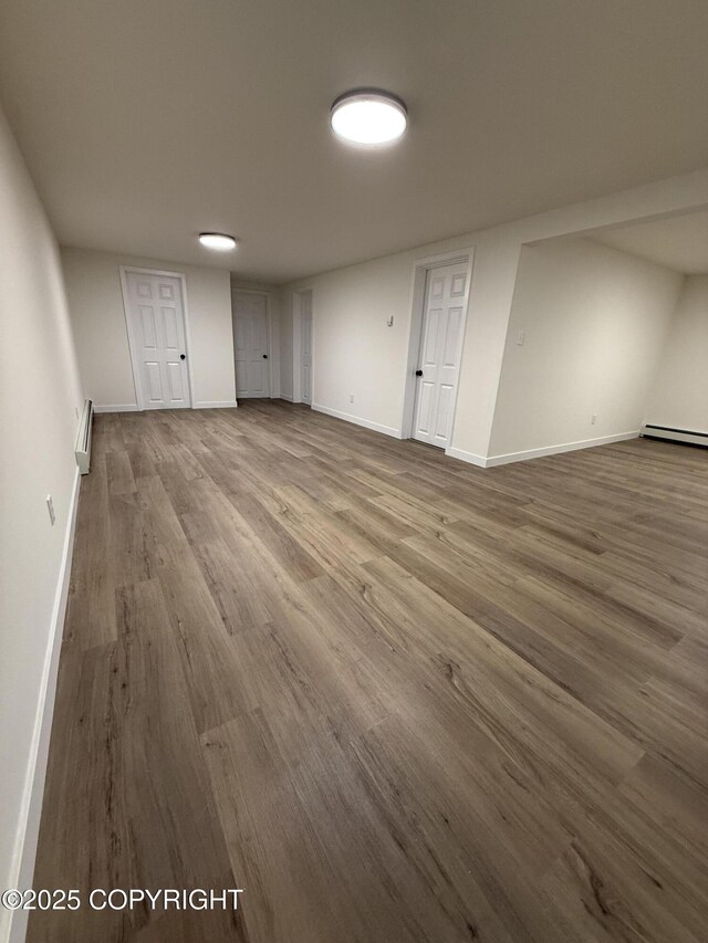 1510 Fathom Dr, Kenai, AK 99611 - below grade area featuring wood finished floors and baseboard heating