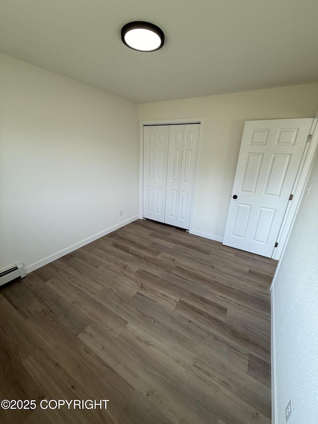 1510 Fathom Dr, Kenai, AK 99611 - unfurnished bedroom featuring dark wood-style flooring and a closet