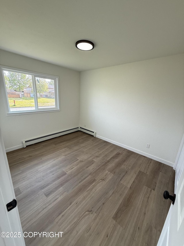 1510 Fathom Dr, Kenai, AK 99611 - empty room featuring baseboard heating and dark wood-type flooring