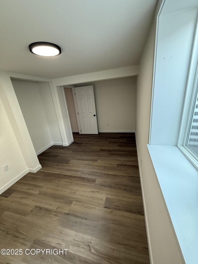 1510 Fathom Dr, Kenai, AK 99611 - unfurnished bedroom with wood finished floors and baseboards