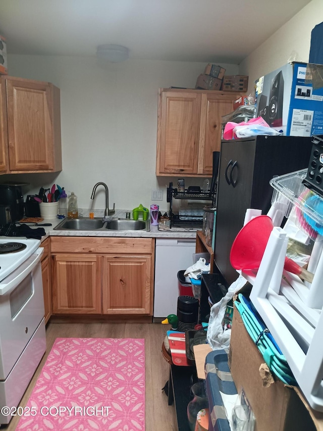1011 Friendly Ln, Anchorage, AK 99504 - kitchen featuring white appliances, light countertops, and light wood finished floors
