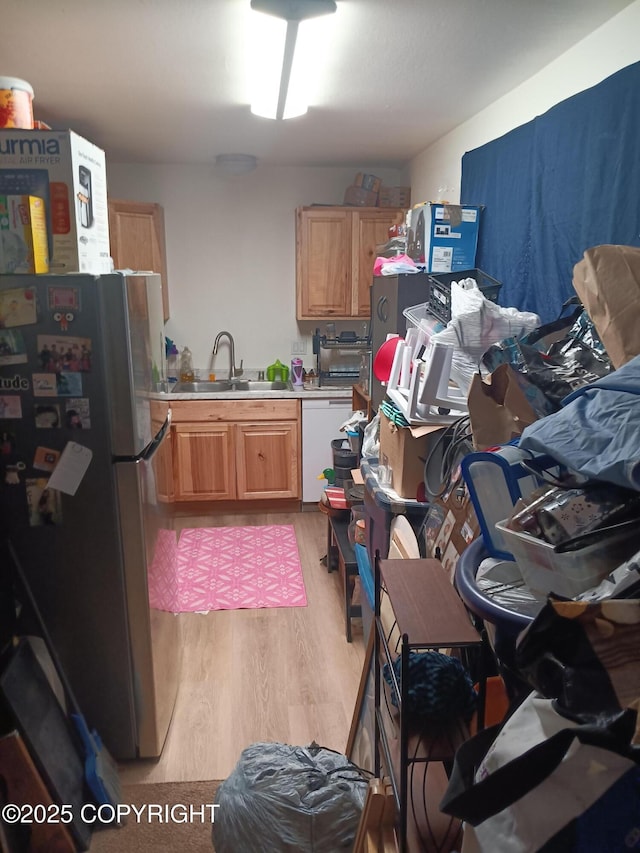 1011 Friendly Ln, Anchorage, AK 99504 - kitchen featuring freestanding refrigerator, dishwasher, light wood-type flooring, and light countertops