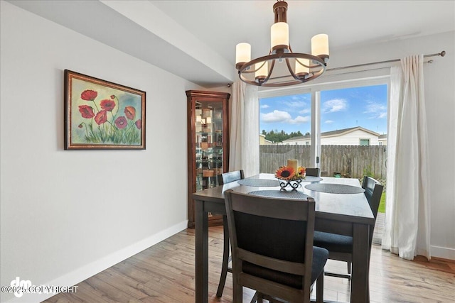 339 Skwentna Dr # 24, Anchorage, AK 99504 - dining space with a chandelier and light wood finished floors