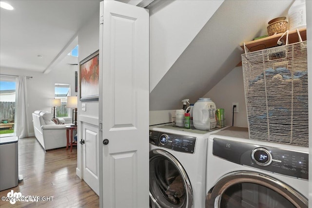 339 Skwentna Dr # 24, Anchorage, AK 99504 - laundry room featuring washing machine and dryer and light wood-style floors