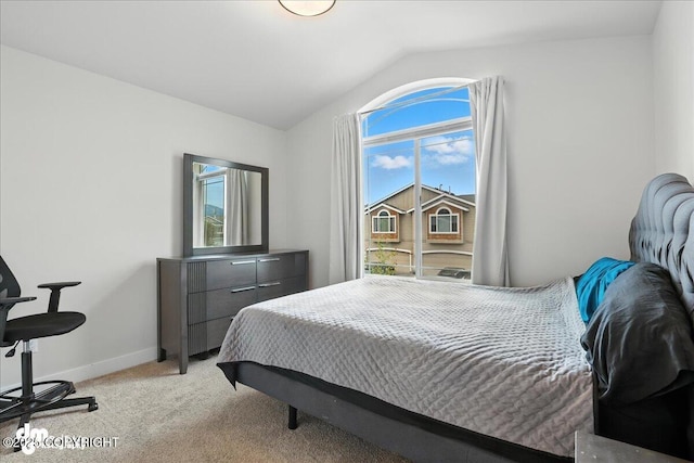 339 Skwentna Dr # 24, Anchorage, AK 99504 - bedroom with lofted ceiling, multiple windows, and light carpet