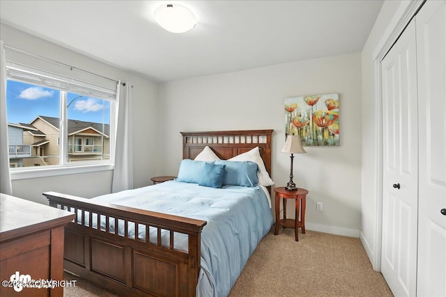 339 Skwentna Dr # 24, Anchorage, AK 99504 - bedroom featuring a closet and light carpet