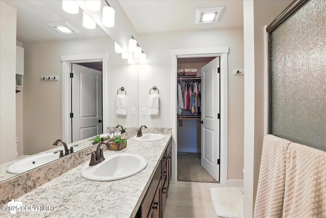 339 Skwentna Dr # 24, Anchorage, AK 99504 - full bath with double vanity, an enclosed shower, and a walk in closet