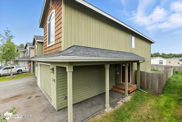 339 Skwentna Dr # 24, Anchorage, AK 99504 - back of property with an attached garage, roof with shingles, and asphalt driveway