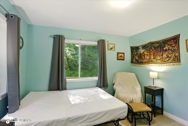 14216 W Norcross St, Big Lake, AK 99623 - bedroom with baseboards and wood finished floors