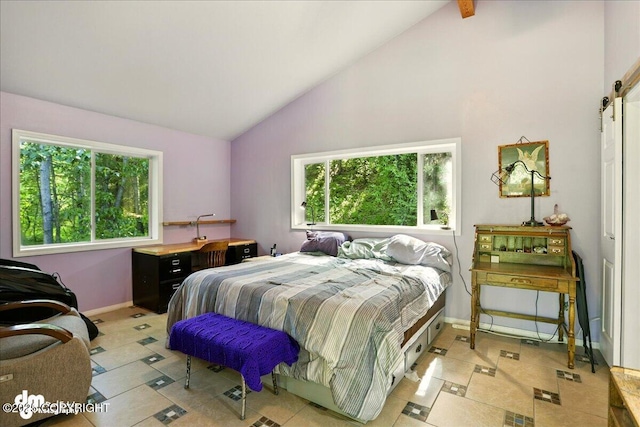 14216 W Norcross St, Big Lake, AK 99623 - bedroom with light tile patterned floors, a barn door, and high vaulted ceiling