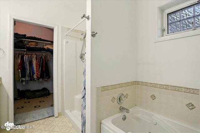 14216 W Norcross St, Big Lake, AK 99623 - full bathroom featuring a spacious closet, a shower stall, and a jetted tub