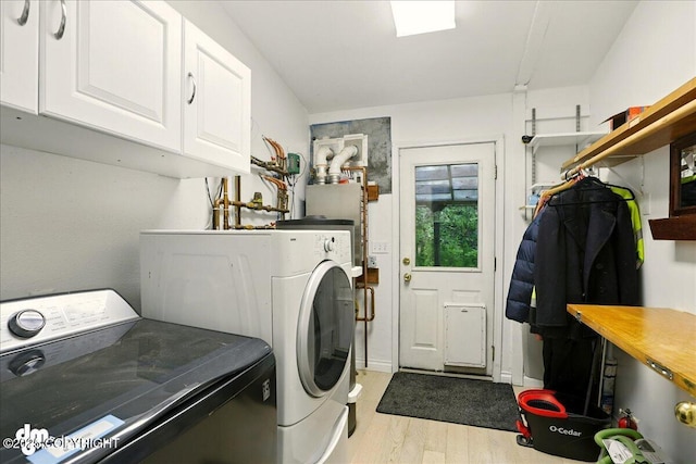 14216 W Norcross St, Big Lake, AK 99623 - laundry room featuring cabinet space, light wood finished floors, and washing machine and dryer