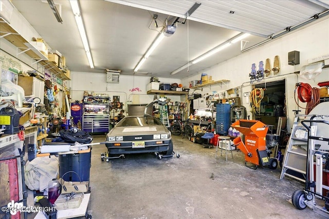 14216 W Norcross St, Big Lake, AK 99623 - garage featuring a garage door opener and a workshop area