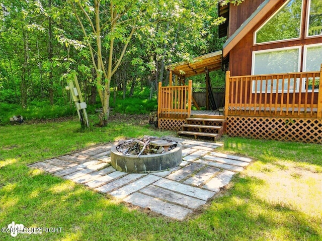 14216 W Norcross St, Big Lake, AK 99623 - view of grassy yard with an outdoor fire pit and a wooden deck