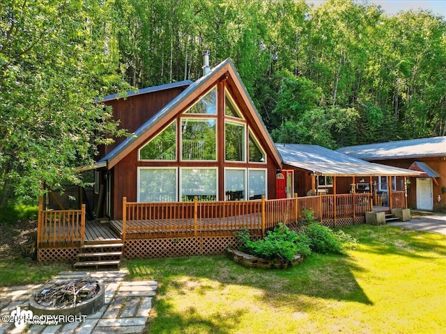 14216 W Norcross St, Big Lake, AK 99623 - back of house featuring a lawn and a wooden deck