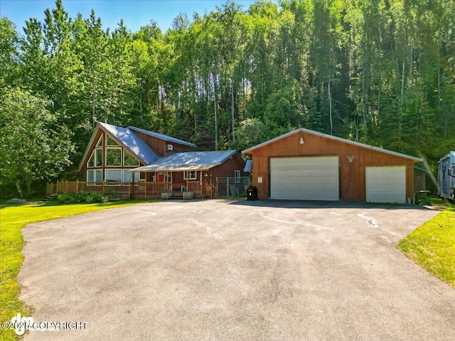 14216 W Norcross St, Big Lake, AK 99623 - view of front facade featuring a garage and an outdoor structure