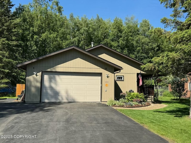 6312 Air Guard Rd, Anchorage, AK 99502 - view of front facade with a front yard and asphalt driveway