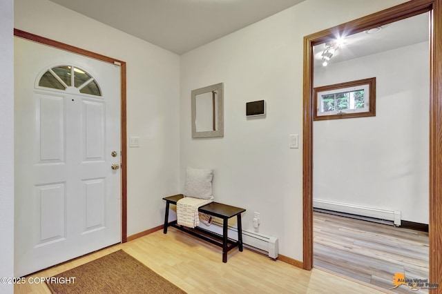 6312 Air Guard Rd, Anchorage, AK 99502 - foyer entrance featuring baseboard heating and light wood finished floors