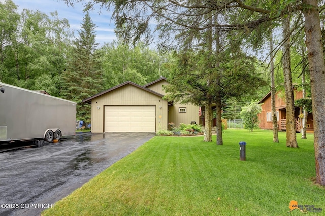 6312 Air Guard Rd, Anchorage, AK 99502 - view of front of property with asphalt driveway, a front yard, and an attached garage