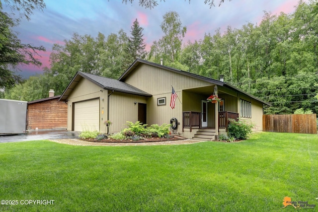 6312 Air Guard Rd, Anchorage, AK 99502 - view of front of home with driveway, a garage, and covered porch