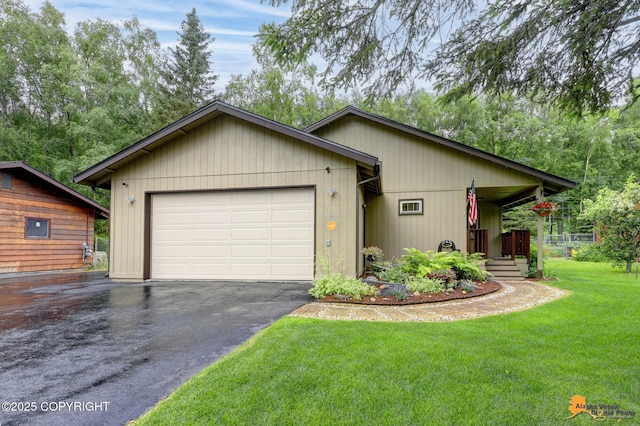 6312 Air Guard Rd, Anchorage, AK 99502 - view of front of property with a front lawn, driveway, a garage, and covered porch