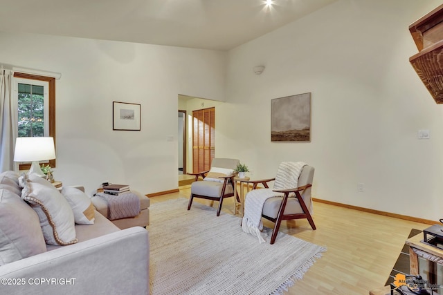 6312 Air Guard Rd, Anchorage, AK 99502 - living area featuring vaulted ceiling and light wood-style flooring