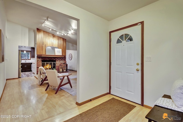 6312 Air Guard Rd, Anchorage, AK 99502 - foyer featuring light wood-style floors and track lighting