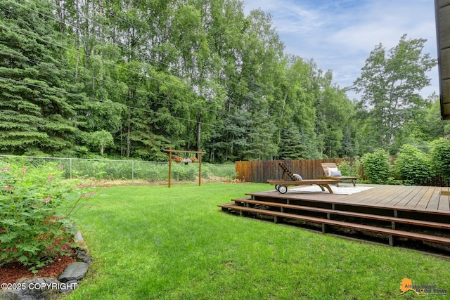 6312 Air Guard Rd, Anchorage, AK 99502 - fenced backyard with a wooden deck