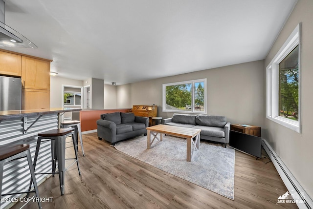 1740 Patterson Ct, Anchorage, AK 99504 - living room with baseboard heating and wood finished floors