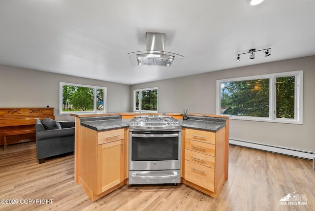 1740 Patterson Ct, Anchorage, AK 99504 - kitchen featuring stainless steel gas stove, a baseboard radiator, open floor plan, and dark countertops