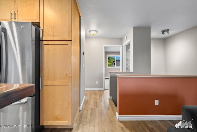 1740 Patterson Ct, Anchorage, AK 99504 - kitchen featuring freestanding refrigerator and light wood finished floors