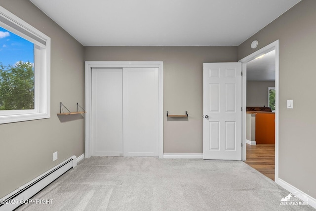 1740 Patterson Ct, Anchorage, AK 99504 - unfurnished bedroom with a baseboard radiator, carpet, and a closet