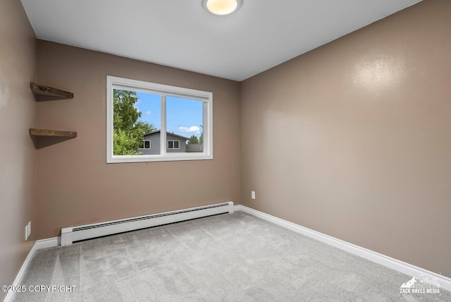 1740 Patterson Ct, Anchorage, AK 99504 - carpeted spare room featuring a baseboard heating unit and baseboards