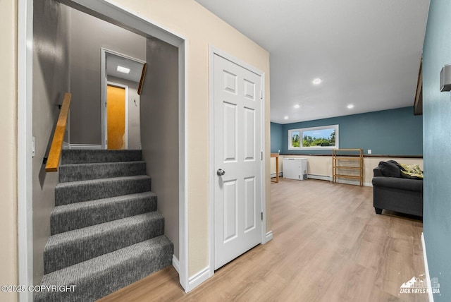 1740 Patterson Ct, Anchorage, AK 99504 - staircase with wood finished floors, recessed lighting, and baseboard heating