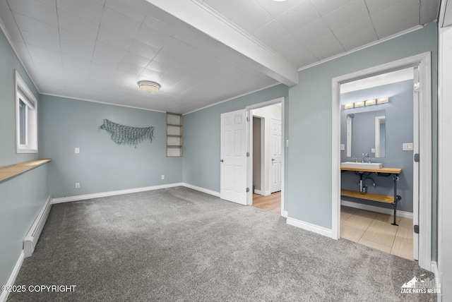 1740 Patterson Ct, Anchorage, AK 99504 - unfurnished bedroom with a baseboard heating unit, carpet, crown molding, and ensuite bathroom