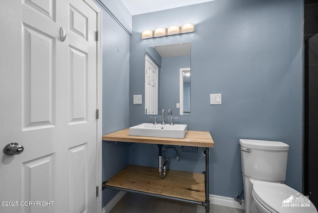 1740 Patterson Ct, Anchorage, AK 99504 - bathroom featuring toilet and baseboards