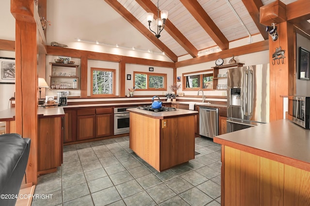 37905 Hall Rd, Sterling, AK 99672 - kitchen featuring appliances with stainless steel finishes, open shelves, plenty of natural light, wood ceiling, and a center island