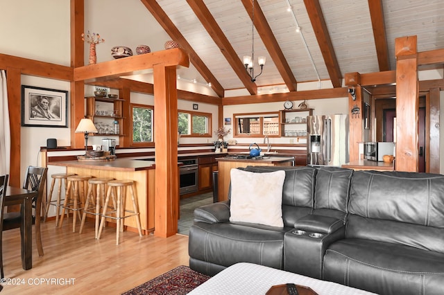 37905 Hall Rd, Sterling, AK 99672 - living room featuring wooden ceiling, a chandelier, and light wood-type flooring