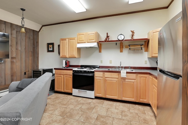 37905 Hall Rd, Sterling, AK 99672 - kitchen featuring range with gas stovetop, freestanding refrigerator, under cabinet range hood, crown molding, and light brown cabinetry