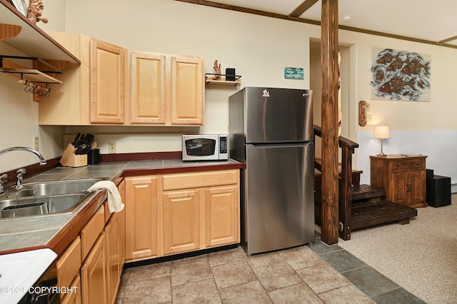 37905 Hall Rd, Sterling, AK 99672 - kitchen with appliances with stainless steel finishes, tile countertops, light brown cabinetry, and light stone finish floors