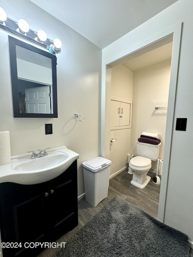 37905 Hall Rd, Sterling, AK 99672 - half bathroom featuring wood finished floors and vanity