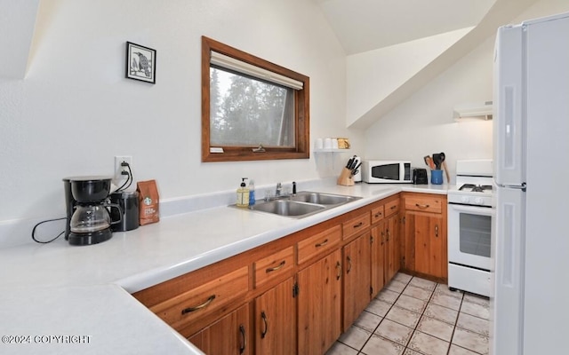 37905 Hall Rd, Sterling, AK 99672 - kitchen featuring white appliances, extractor fan, light countertops, vaulted ceiling, and light tile patterned flooring