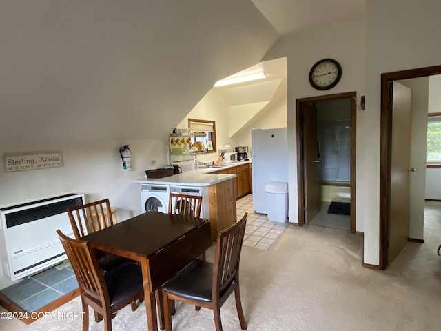 37905 Hall Rd, Sterling, AK 99672 - dining space with vaulted ceiling, washer / clothes dryer, light carpet, and heating unit