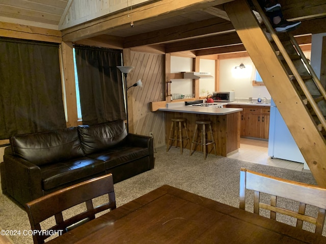 37905 Hall Rd, Sterling, AK 99672 - living area with wooden walls, light carpet, lofted ceiling, and wooden ceiling