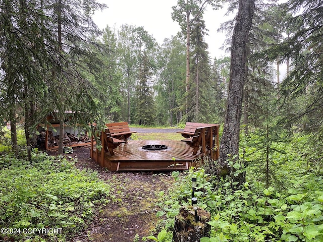37905 Hall Rd, Sterling, AK 99672 - view of yard featuring a wooden deck and a forest view