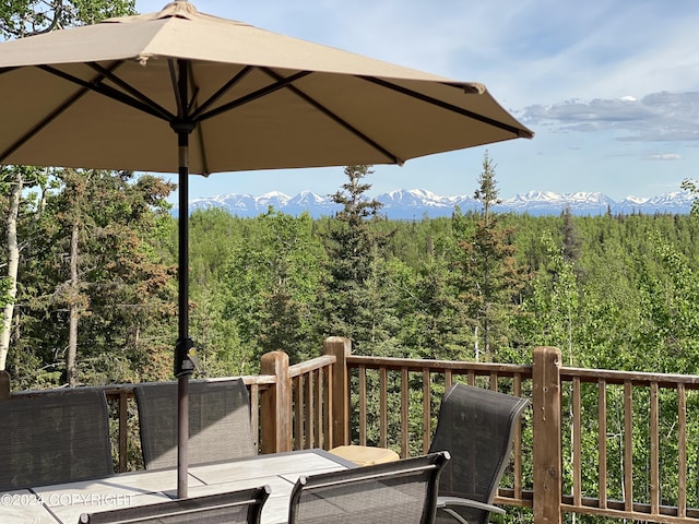 37905 Hall Rd, Sterling, AK 99672 - wooden terrace with a view of trees, a mountain view, and outdoor dining area