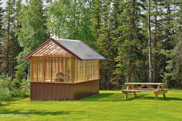 37905 Hall Rd, Sterling, AK 99672 - view of greenhouse featuring a yard and a view of trees