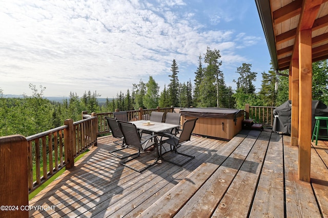37905 Hall Rd, Sterling, AK 99672 - wooden deck featuring a hot tub, outdoor dining space, and a grill