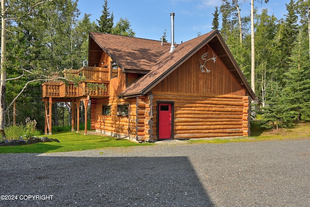 37905 Hall Rd, Sterling, AK 99672 - log cabin with log siding, roof with shingles, and a wooden deck